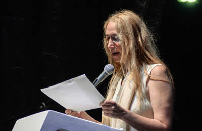 Lectura de  Kate Newmann (Irlanda del Norte). © #25FIPM. Photo: Sara Marin